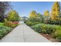 Long driveway leading to a spacious two-story home with attached garage at 7181 Longview Dr, Niwot, CO 80503