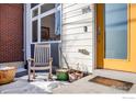 Inviting front entry with rocking chair and potted plants at 105 N Iowa Ave, Lafayette, CO 80026