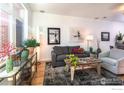 Bright and airy living room with hardwood floors and comfortable seating at 105 N Iowa Ave, Lafayette, CO 80026