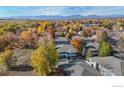 Community overview showcasing beautiful autumn foliage and mountain views at 1111 Elysian Field Dr # D, Lafayette, CO 80026