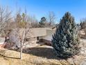 An aerial view of a single Gathering home on a landscaped lot with mature trees at 1130 Navajo Pl, Berthoud, CO 80513