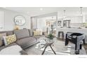 Bright living room shows an open layout with the kitchen and dining area at 1310 Toedtli Dr, Boulder, CO 80305