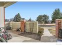 Property features a well-manicured yard and a charming fence at 13900 Lake Song Ln # 2, Broomfield, CO 80023