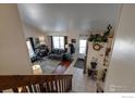 Spacious living room with high ceilings, hardwood floors, and a view to the entryway at 1621 Flemming Dr, Longmont, CO 80501