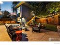 Modern backyard patio with seating area and fire pit at 2345 South St, Boulder, CO 80302