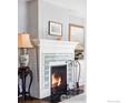 Elegant fireplace featuring a decorative mantel and black fire tools at 2424 4Th St, Boulder, CO 80304