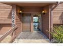 Building entryway with brown doors and brick flooring at 2640 Juniper Ave # 2, Boulder, CO 80304