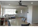 Bright dining area with hardwood floors and a ceiling fan at 305 S Carr St, Lakewood, CO 80226