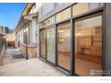 A spacious outdoor patio leads to a home office with custom built-ins at 33 Garfield St, Denver, CO 80206