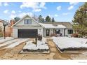 Charming ranch home with updated exterior and snowy front yard at 5166 Forsythe Pl, Boulder, CO 80303