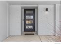 Modern front door with glass panels adds curb appeal at 5166 Forsythe Pl, Boulder, CO 80303