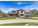 Stunning two-story home with a large driveway and mountain views at 5277 Westridge Dr, Boulder, CO 80301