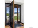 Elegant front door opens to reveal a beautiful view at 5277 Westridge Dr, Boulder, CO 80301