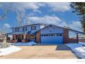 Exterior of a two-story home with a blue facade and attached garage at 5580 Colt Dr, Longmont, CO 80503