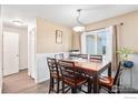 Dining room with wood table and chairs, near kitchen at 622 Beth Ave, Fort Lupton, CO 80621