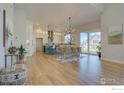 Light and airy dining room with hardwood floors, and access to the patio at 904 Eldorado Ln, Louisville, CO 80027