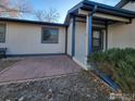 Inviting front patio with flagstone and landscaping at 1248 Ilium Dr, Lafayette, CO 80026