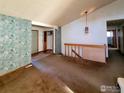 Open living room with high ceilings and staircase at 1248 Ilium Dr, Lafayette, CO 80026