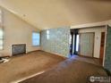 Spacious living room with fireplace and entryway at 1248 Ilium Dr, Lafayette, CO 80026