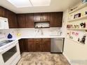 Well-equipped kitchen featuring wood cabinets and appliances at 13631 E Marina Dr # 108, Aurora, CO 80014