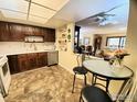 Bright kitchen with wood cabinets, and breakfast nook at 13631 E Marina Dr # 108, Aurora, CO 80014