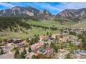 Aerial view of a house nestled in a mountain neighborhood at 1715 View Point Rd, Boulder, CO 80305