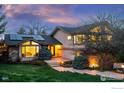 Two-story house exterior at dusk with solar panels and landscaping at 1715 View Point Rd, Boulder, CO 80305