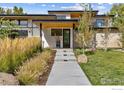 Modern home exterior with walkway, landscaping, and stone accents at 2125 Upland Ave, Boulder, CO 80304