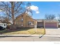 House exterior showcasing a well-maintained lawn and driveway at 2132 Ridge Dr, Broomfield, CO 80020