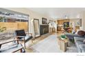 Open living space with fireplace and kitchen view at 219 29Th St, Boulder, CO 80305