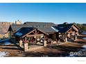 Ranch home exterior showcasing a large patio and mountain views at 515 Indian Mountain Rd, Longmont, CO 80503