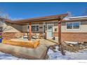 Inviting front porch with wooden posts and comfortable seating area at 616 S Carr Ave, Lafayette, CO 80026