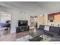 Open living room with hardwood floors and a view of the bedroom at 805 29Th St # 405, Boulder, CO 80303