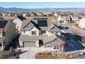 Two-story house with solar panels and mountain views at 864 Dakota Ln, Erie, CO 80516