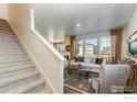 Carpeted stairs leading to the upper level of the home at 889 Crest St, Lochbuie, CO 80603