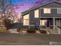 Charming two-story home with unique architectural windows and a lovely purple door at 1183 James Ct # 1, Lafayette, CO 80026