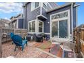 Outdoor patio with comfortable seating, colorful rug, and fenced-in yard at 1183 James Ct # 1, Lafayette, CO 80026