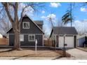 Stylish home featuring a detached garage, complemented by a well-maintained yard at 125 Telluride Pl, Longmont, CO 80504