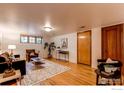 Finished basement living room with cozy seating, hardwood floors, and modern accents at 1342 Milwaukee St # 5, Denver, CO 80206