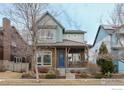 Two-story craftsman style home with a metal roof and stone accents at 1345 Snowberry Ln, Louisville, CO 80027