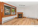 Living room with hardwood floors, fireplace and large window at 1430 18Th St # 1, Boulder, CO 80302