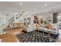 Spacious living room features hardwood floors and neutral tones throughout the space at 154 S Jackson St, Denver, CO 80209