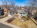 This home includes a two-car garage and a charming front porch, nestled in a friendly neighborhood at 1631 Centaur Cir, Lafayette, CO 80026