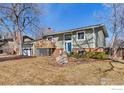 Inviting home with a cozy front porch and well-maintained landscaping, creating a welcoming curb appeal at 1631 Centaur Cir, Lafayette, CO 80026