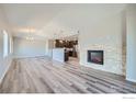 Spacious living area with hardwood floors and fireplace at 2417 Calais Dr # G, Longmont, CO 80504