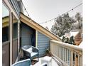 Outdoor space with stylish seating, complemented by ambient string lights and snowy views at 3025 Broadway St # 40, Boulder, CO 80304