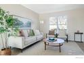 Light-filled living room, featuring a neutral palette and stylish decor at 402 Baron Ave, Lafayette, CO 80026