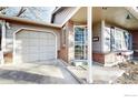 Brick home with attached garage and covered entryway at 4101 W 111Th Cir, Westminster, CO 80031