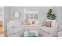 Cozy living room featuring neutral tones, comfortable seating, and bright natural light at 4302 Apple Way, Boulder, CO 80301