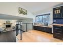 Bright living area with a fireplace, large window, and modern decor at 4667 Harwich St, Boulder, CO 80301